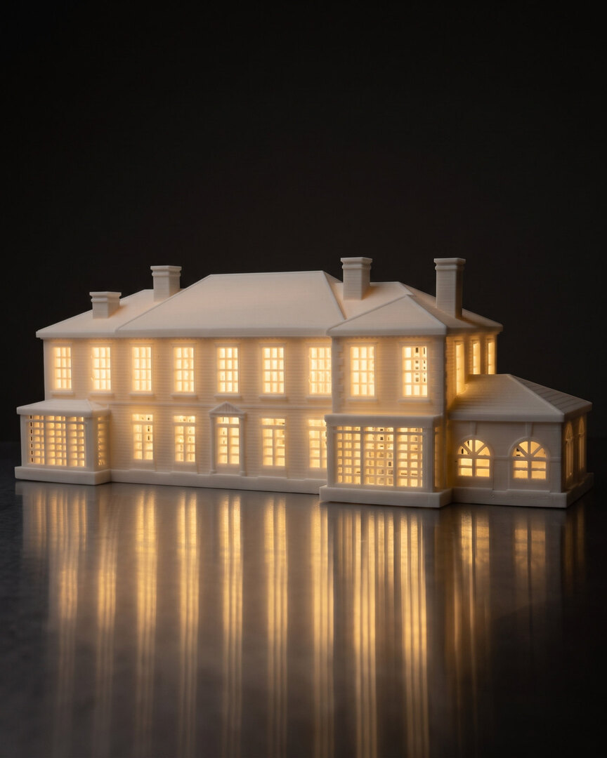 A real finished white house piece of a large colonial home, every window glowing from inside on brushed steel