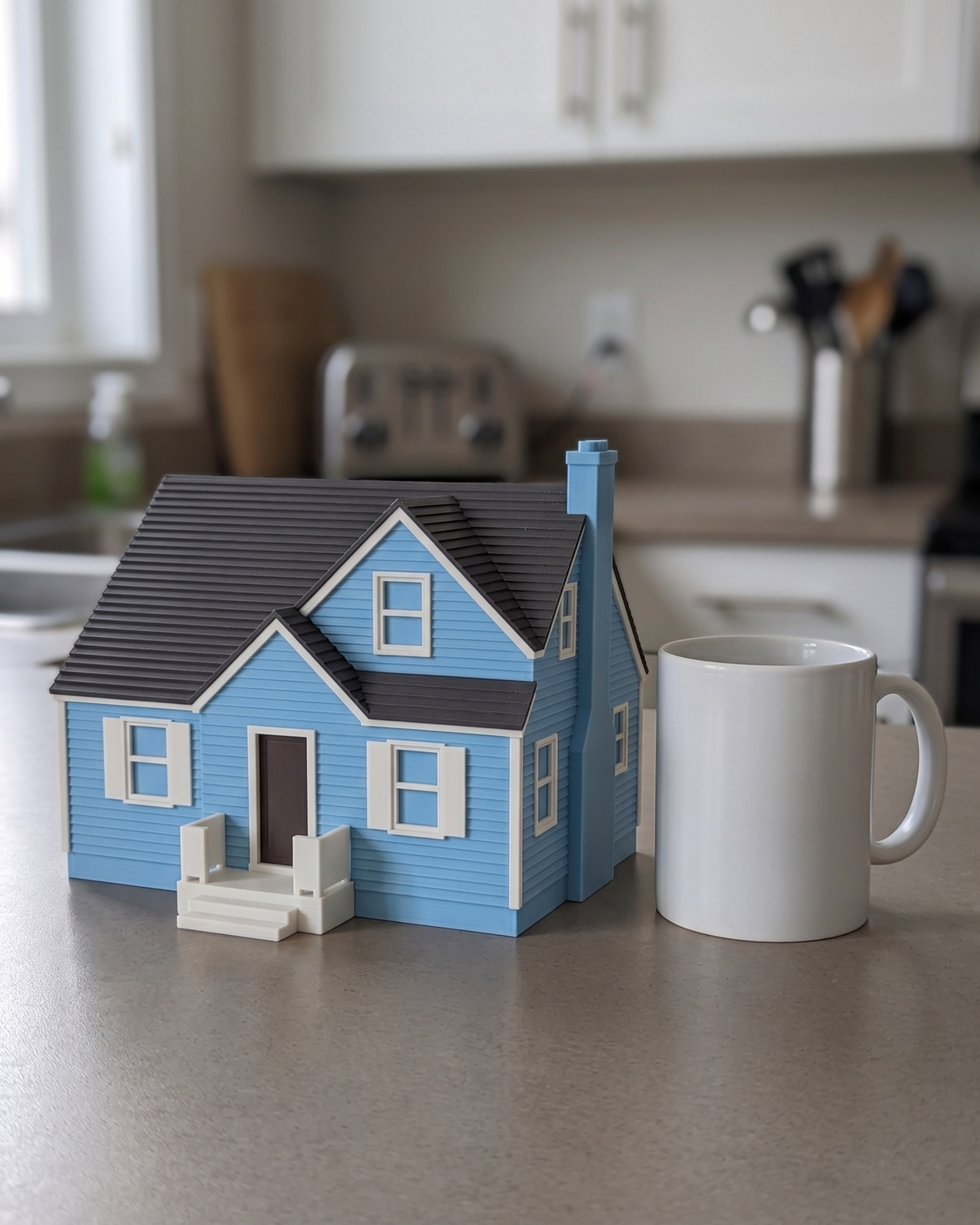 A Medium multicolor house keepsake beside a white coffee mug on a kitchen counter, in a generated picture
